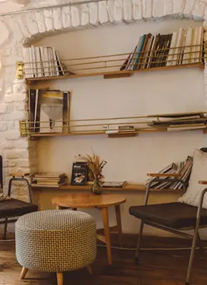 Open shelves and a round stool